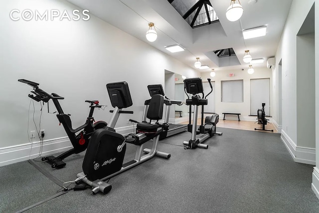 gym featuring baseboards