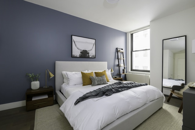bedroom featuring wood finished floors