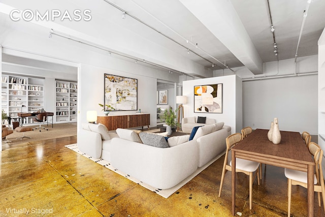 living room with concrete floors and track lighting