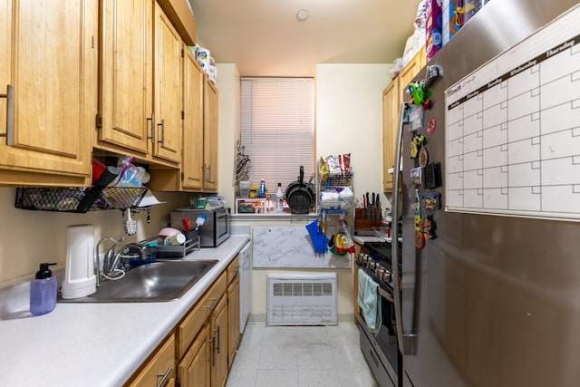 kitchen with sink and appliances with stainless steel finishes