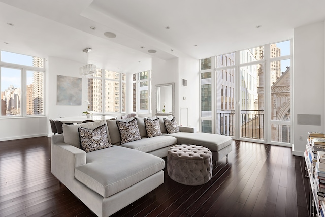 408 E 79th St Unit 7-Ad, New York City, NY 10075 - living area with dark wood-type flooring, expansive windows, and baseboards