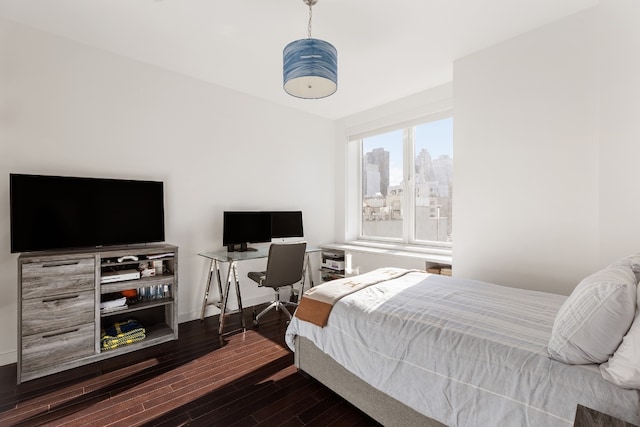 bedroom featuring dark hardwood / wood-style flooring