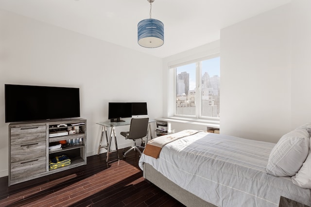408 E 79th St Unit 7-Ad, New York City, NY 10075 - bedroom with dark wood-style floors and baseboards