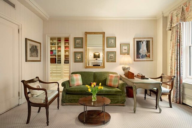 dining area featuring hardwood / wood-style flooring and ornamental molding