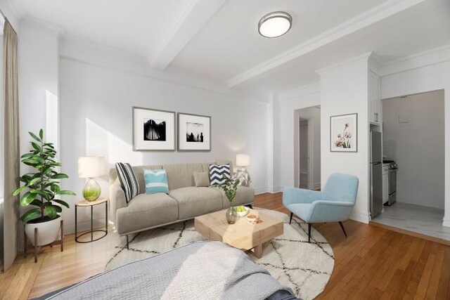 living room with hardwood / wood-style flooring, ornamental molding, and beamed ceiling