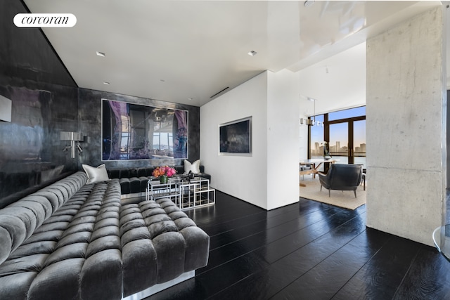 living room with dark hardwood / wood-style flooring and expansive windows