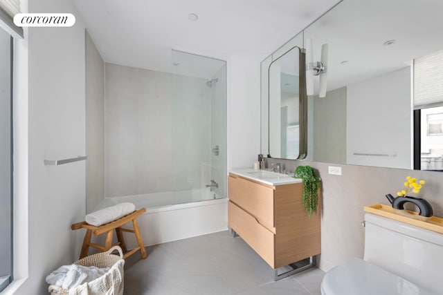 bathroom featuring shower / bath combination with glass door, vanity, and toilet