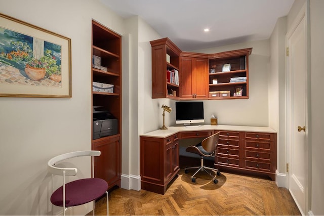 home office featuring built in desk and light parquet flooring