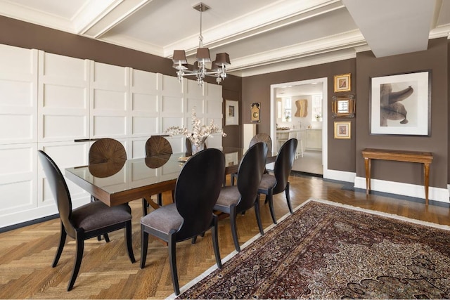 dining area with ornamental molding, parquet flooring, and an inviting chandelier