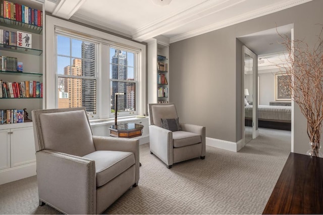 sitting room featuring crown molding, light hardwood / wood-style floors, and beamed ceiling