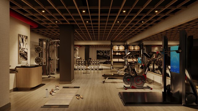 workout area with wood-type flooring