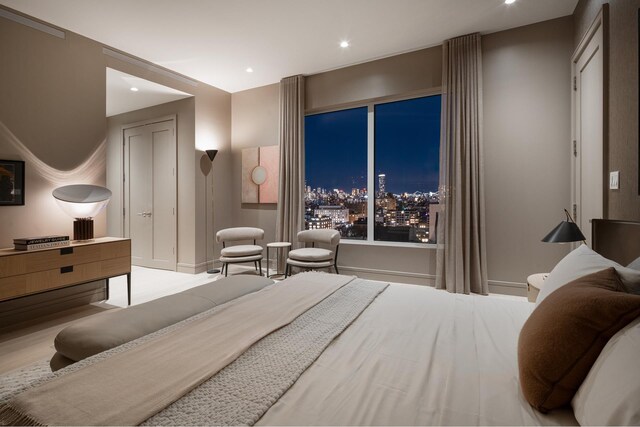 bedroom with light hardwood / wood-style floors