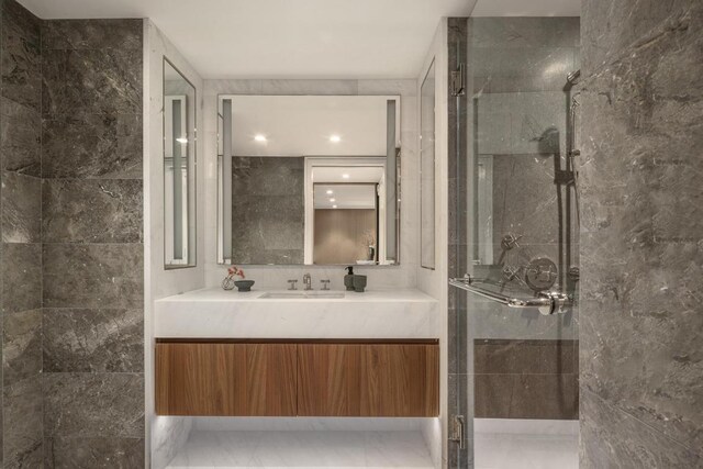 bathroom with vanity and an enclosed shower