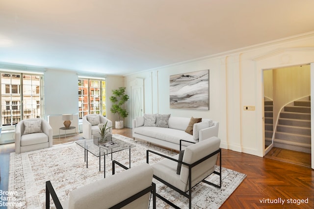 living room with crown molding and dark parquet floors