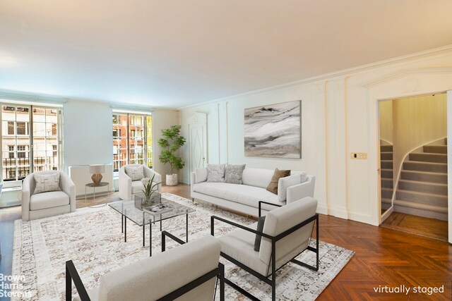 hallway with crown molding and light colored carpet