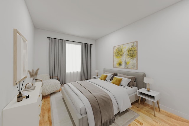 bedroom with light wood-type flooring and baseboards