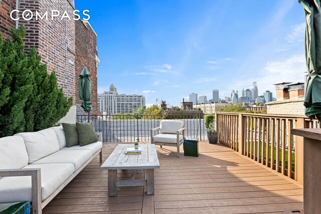 wooden deck featuring an outdoor hangout area