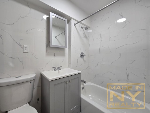 full bath featuring toilet, tasteful backsplash, bathtub / shower combination, and vanity