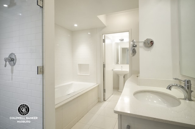 bathroom featuring separate shower and tub, tile patterned flooring, and sink