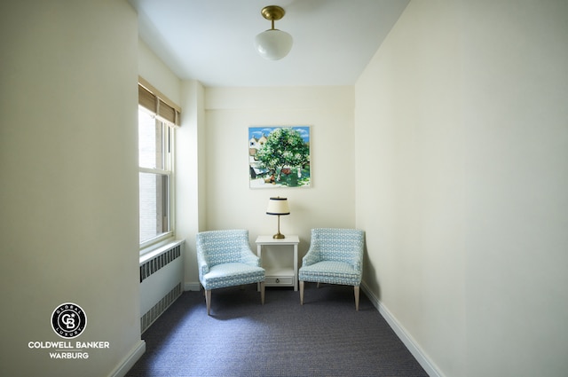 unfurnished room featuring radiator heating unit