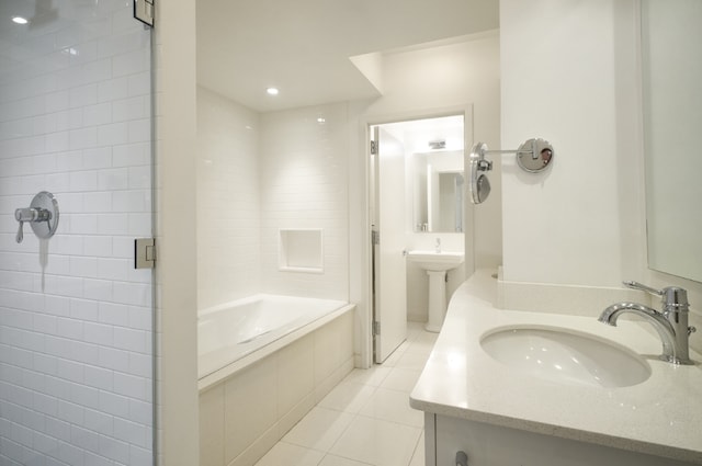 bathroom featuring sink, tile patterned floors, and plus walk in shower