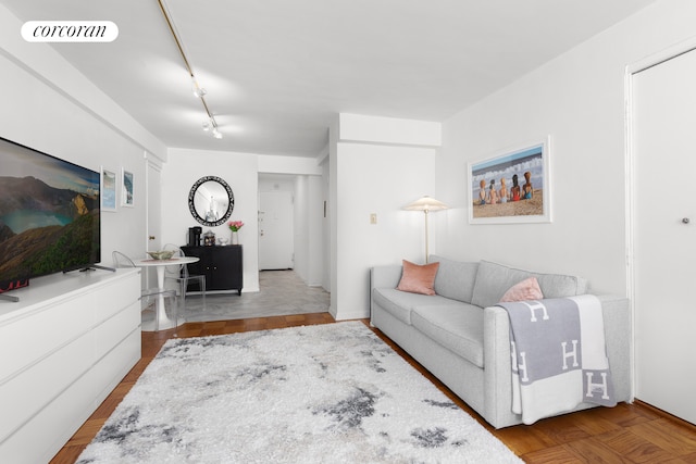 living room with rail lighting and visible vents