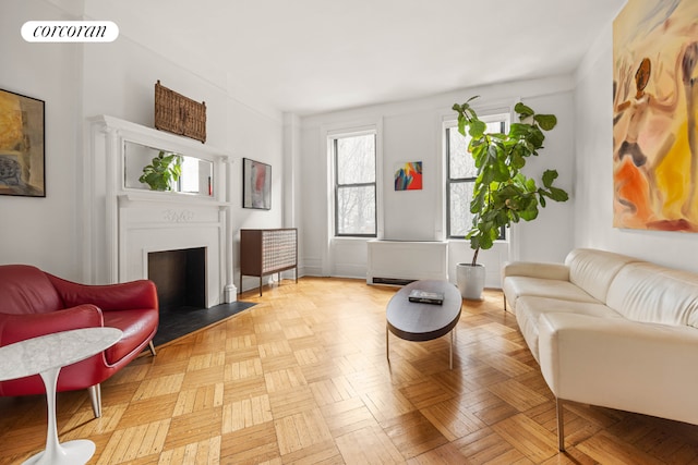 living area featuring light parquet flooring