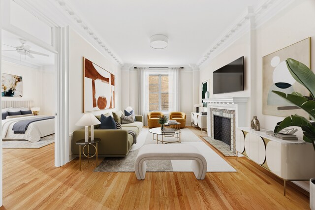 unfurnished living room featuring crown molding, ceiling fan, radiator heating unit, and light wood-type flooring