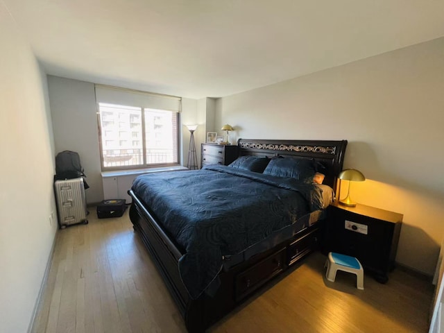 bedroom with wood-type flooring