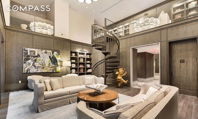 community lobby with a towering ceiling and stairway