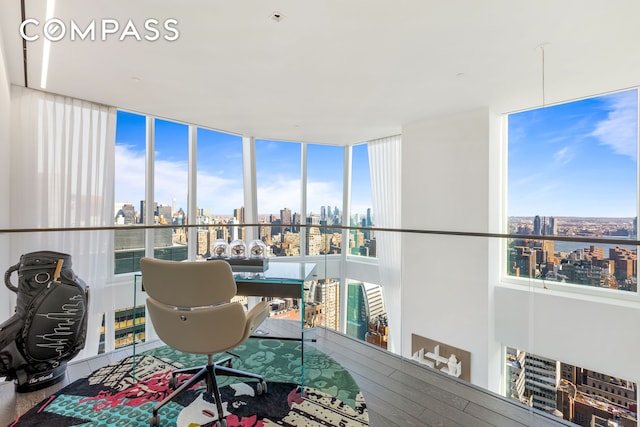 home office with a skyline view and a wall of windows