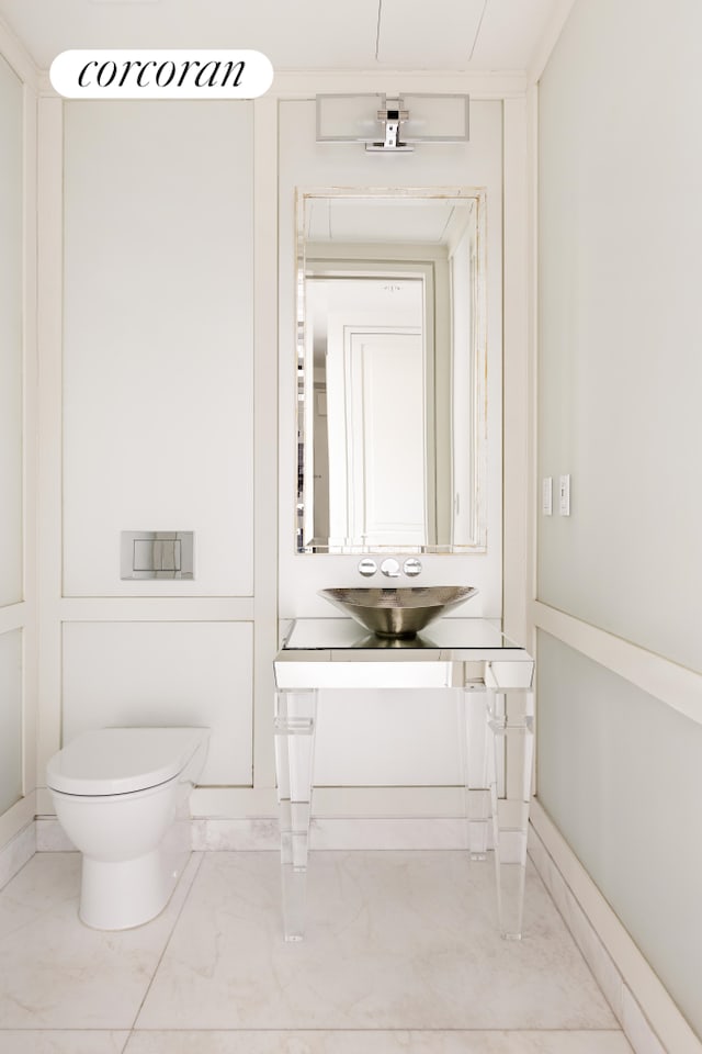 bathroom featuring marble finish floor, vanity, and toilet