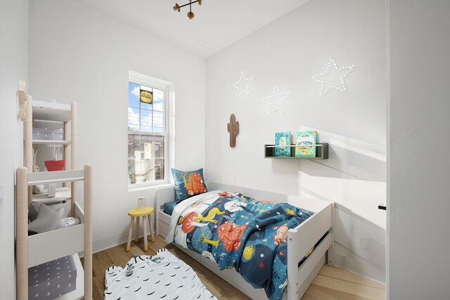 125 Beadel St, New York City, NY 11222 - bedroom with wood finished floors