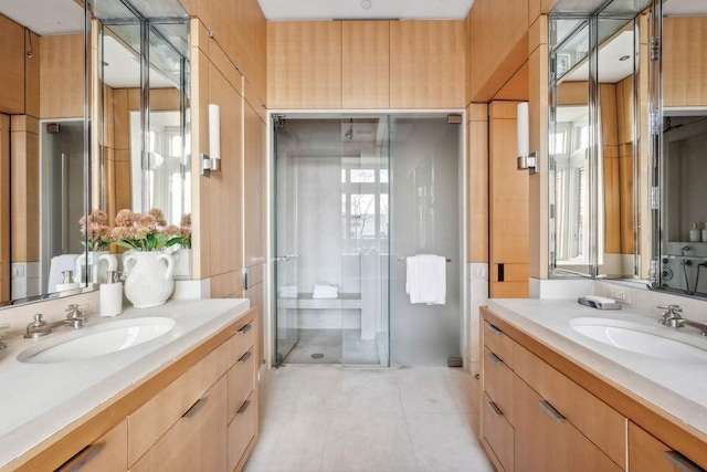 bathroom featuring vanity, tile patterned floors, and a shower with door