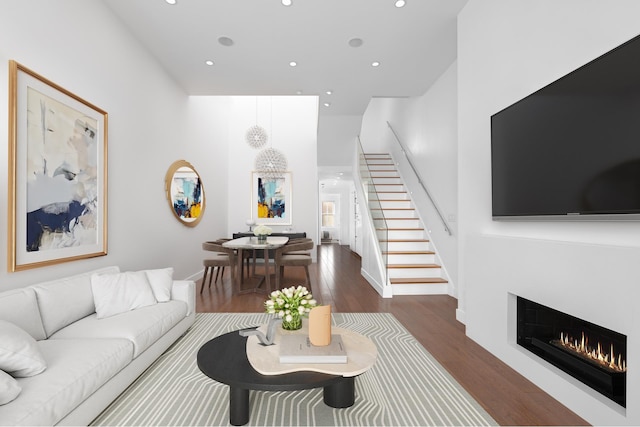 103 W 89th St Unit 3/4A, New York City, NY 10024 - living room featuring recessed lighting, stairs, wood finished floors, and a warm lit fireplace