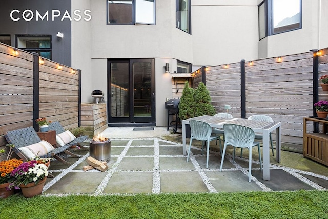 view of patio featuring a grill