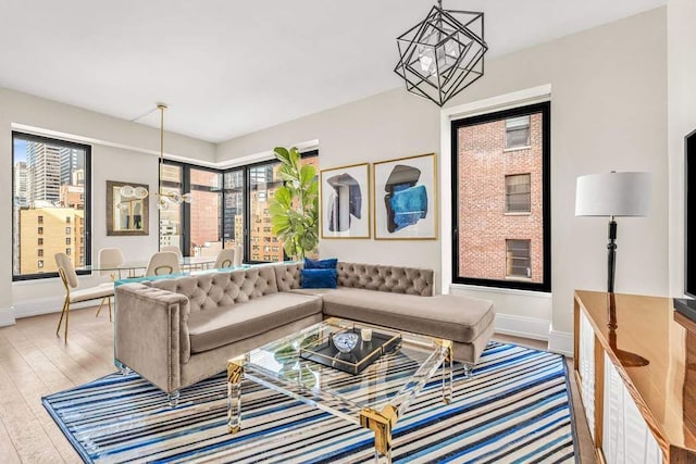 living room featuring hardwood / wood-style flooring and a notable chandelier