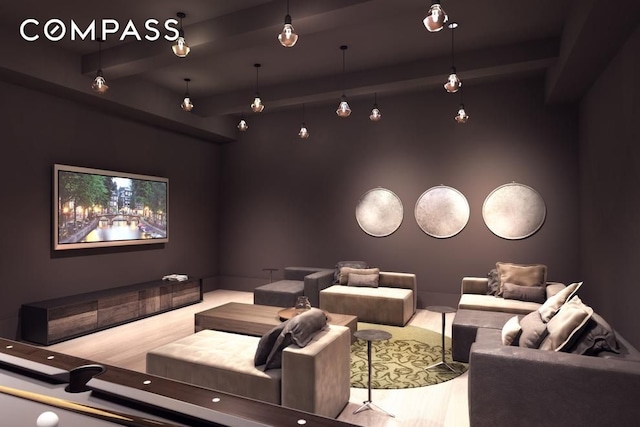 home theater with beam ceiling and wood finished floors