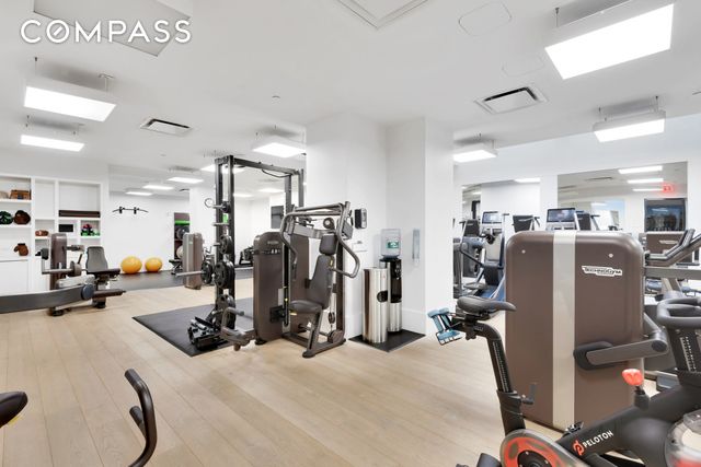 workout area featuring visible vents and wood finished floors