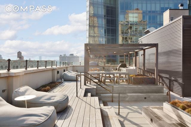 wooden deck with a city view