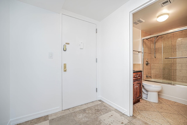 full bath featuring enclosed tub / shower combo, visible vents, tile patterned floors, and toilet