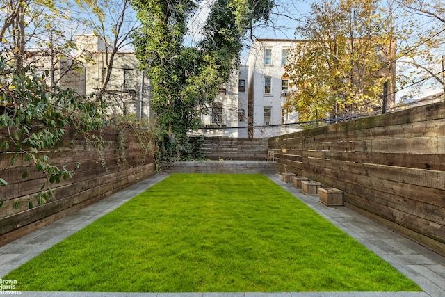 view of yard with a fenced backyard