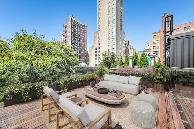 deck featuring a view of city and outdoor lounge area