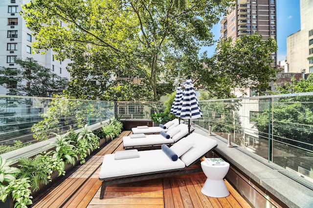 wooden deck with a city view