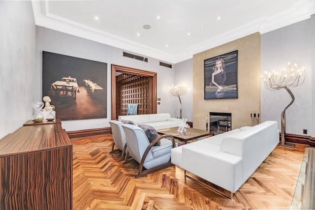 living room featuring baseboards, visible vents, recessed lighting, ornamental molding, and a large fireplace