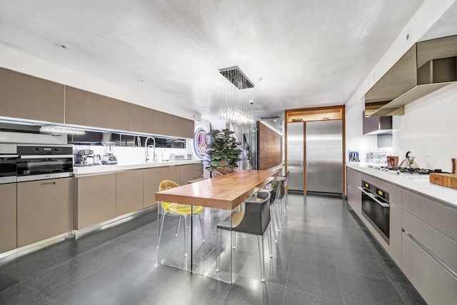 kitchen featuring open shelves, stainless steel appliances, modern cabinets, and light countertops