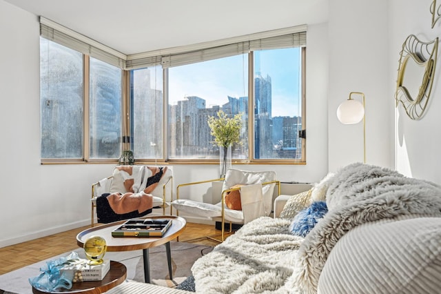 interior space featuring a city view and baseboards