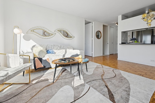 living area featuring baseboards