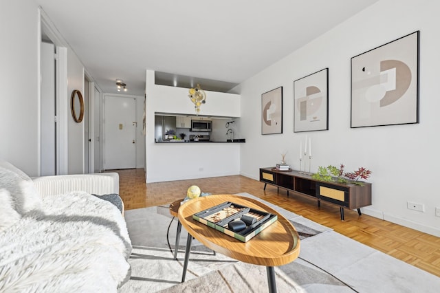 living room featuring baseboards