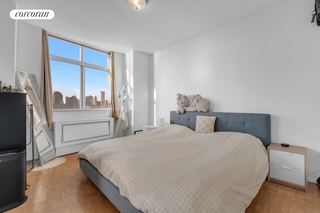 bedroom featuring light parquet floors